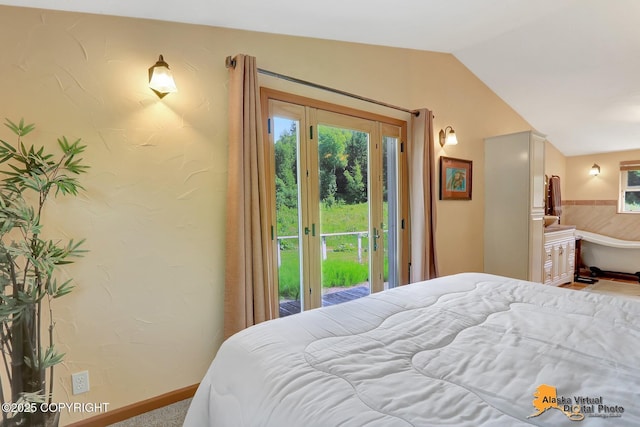 23324 Greatland Dr, Chugiak, AK 99577 - bedroom featuring access to exterior, vaulted ceiling, multiple windows, and ensuite bath