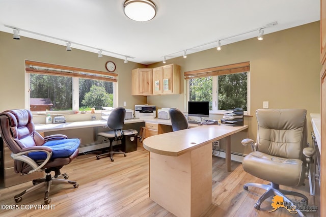 23324 Greatland Dr, Chugiak, AK 99577 - office area with track lighting, healthy amount of natural light, light wood-style flooring, and baseboard heating