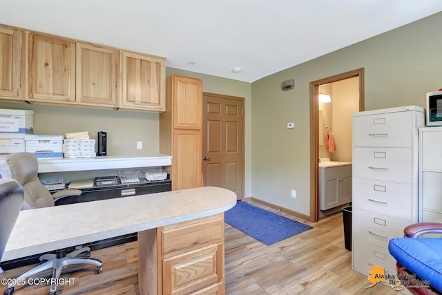 23324 Greatland Dr, Chugiak, AK 99577 - office area featuring light wood-style floors and a sink