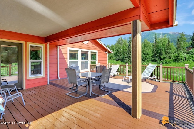 23324 Greatland Dr, Chugiak, AK 99577 - wooden deck featuring outdoor dining area