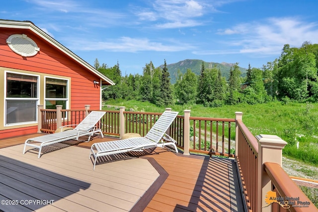 23324 Greatland Dr, Chugiak, AK 99577 - wooden deck featuring a mountain view and a view of trees