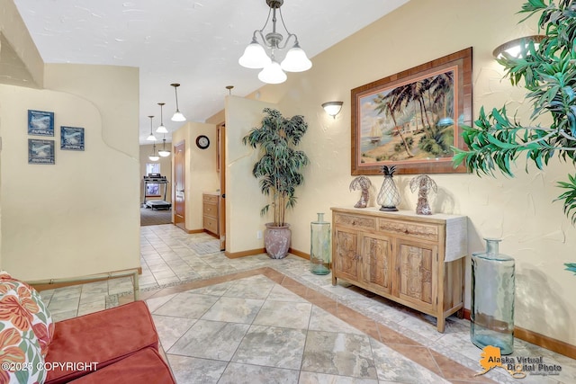 23324 Greatland Dr, Chugiak, AK 99577 - hall featuring a chandelier and inlaid floor details