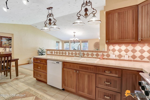 23324 Greatland Dr, Chugiak, AK 99577 - kitchen featuring dishwasher, lofted ceiling, light countertops, backsplash, and a chandelier