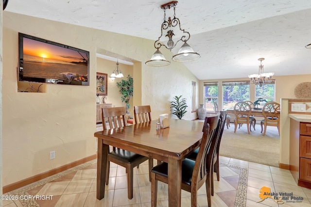 23324 Greatland Dr, Chugiak, AK 99577 - dining space featuring a chandelier, light tile patterned floors, lofted ceiling, light carpet, and a textured ceiling