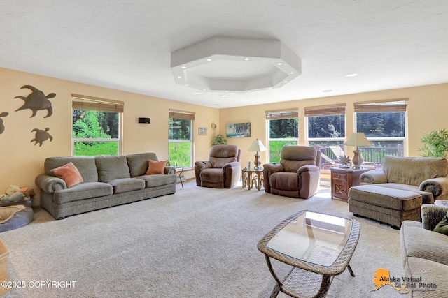 23324 Greatland Dr, Chugiak, AK 99577 - carpeted living room featuring a raised ceiling and recessed lighting