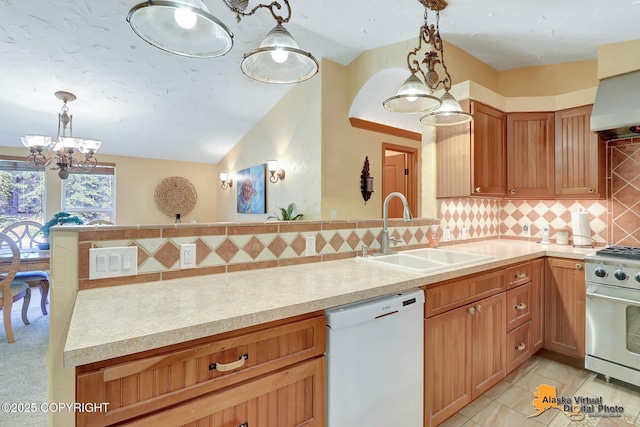 23324 Greatland Dr, Chugiak, AK 99577 - kitchen with white dishwasher, high end stainless steel range oven, a chandelier, light countertops, and tasteful backsplash