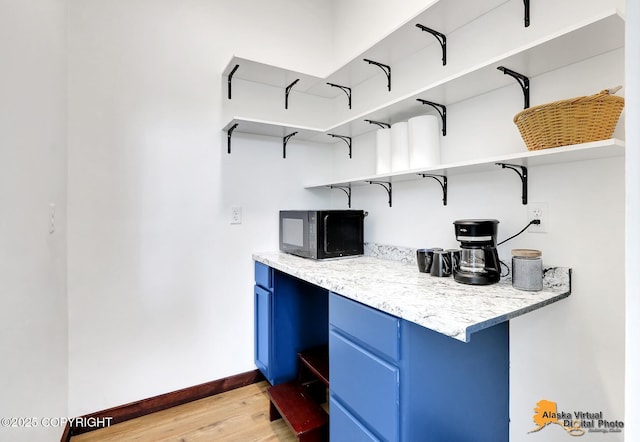 3528 S Mills Ct, Big Lake, AK 99623 - bar area with black microwave and light wood-style flooring