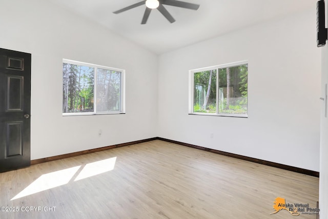3528 S Mills Ct, Big Lake, AK 99623 - spare room featuring plenty of natural light, a ceiling fan, wood finished floors, and lofted ceiling