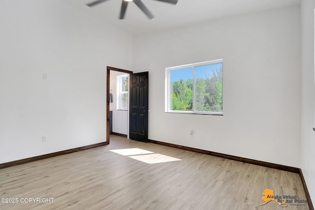 3528 S Mills Ct, Big Lake, AK 99623 - empty room with a ceiling fan, wood finished floors, and lofted ceiling
