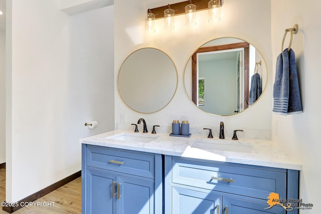 3528 S Mills Ct, Big Lake, AK 99623 - full bathroom featuring double vanity and wood finished floors
