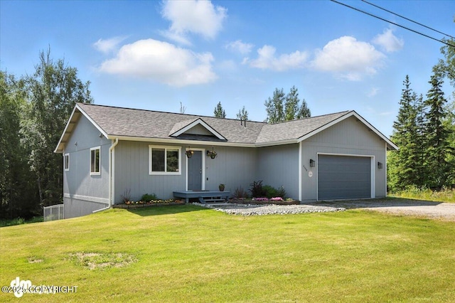 2740 S Rue De La Paix Loop, Wasilla, AK 99623 - single story home with gravel driveway, a garage, a front yard, and roof with shingles