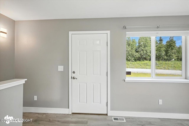 2740 S Rue De La Paix Loop, Wasilla, AK 99623 - entryway with baseboards and light wood-style flooring