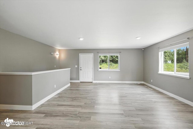 2740 S Rue De La Paix Loop, Wasilla, AK 99623 - spare room featuring wood finished floors and recessed lighting