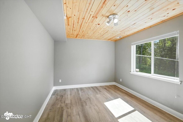 2740 S Rue De La Paix Loop, Wasilla, AK 99623 - spare room with wooden ceiling and wood finished floors