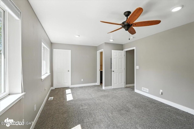 2740 S Rue De La Paix Loop, Wasilla, AK 99623 - unfurnished bedroom with carpet floors, multiple windows, recessed lighting, and ceiling fan