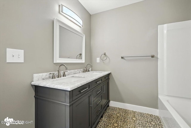 2740 S Rue De La Paix Loop, Wasilla, AK 99623 - full bathroom with double vanity, a tub to relax in, and tile patterned floors
