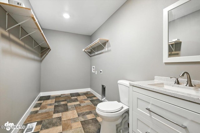 2740 S Rue De La Paix Loop, Wasilla, AK 99623 - half bath featuring stone finish flooring and vanity