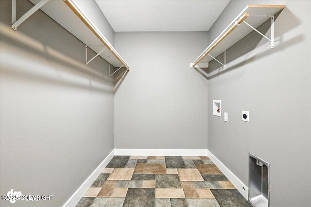 2740 S Rue De La Paix Loop, Wasilla, AK 99623 - laundry room with hookup for a washing machine, electric dryer hookup, and stone finish floors