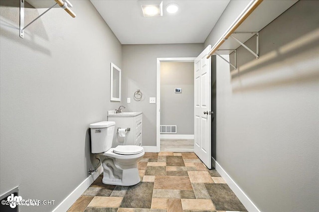 2740 S Rue De La Paix Loop, Wasilla, AK 99623 - bathroom featuring vanity and stone finish flooring