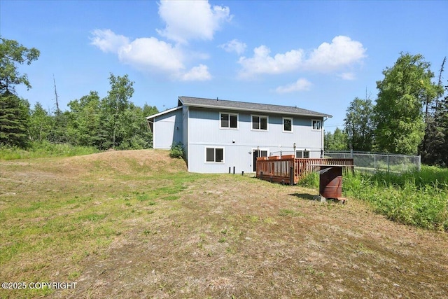 2740 S Rue De La Paix Loop, Wasilla, AK 99623 - rear view of house featuring a wooden deck and a yard