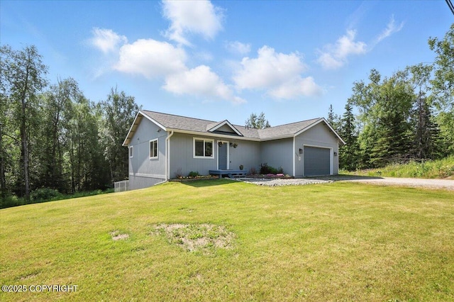 2740 S Rue De La Paix Loop, Wasilla, AK 99623 - ranch-style house featuring driveway, a garage, and a front yard