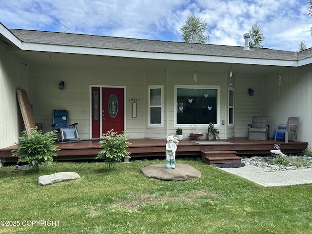 19343 Alma Ave, Chugiak, AK 99567 - view of exterior entry featuring covered porch and a yard