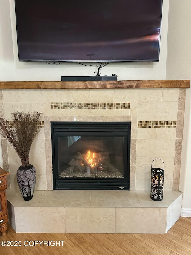 19343 Alma Ave, Chugiak, AK 99567 - detailed view of wood finished floors and a tile fireplace
