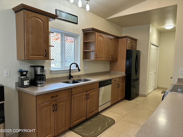 19343 Alma Ave, Chugiak, AK 99567 - kitchen with freestanding refrigerator, dishwasher, lofted ceiling, light countertops, and range
