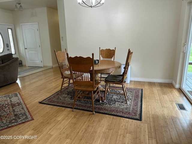 19343 Alma Ave, Chugiak, AK 99567 - dining space with wood finished floors and a chandelier