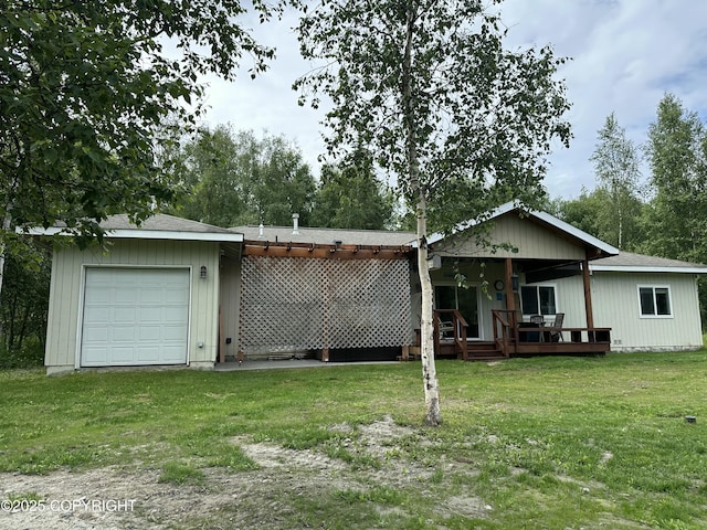 19343 Alma Ave, Chugiak, AK 99567 - back of property featuring a yard, a wooden deck, and an attached garage
