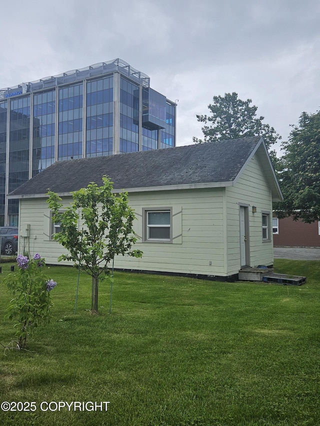 811 K St, Anchorage, AK 99501 - view of property exterior with a lawn