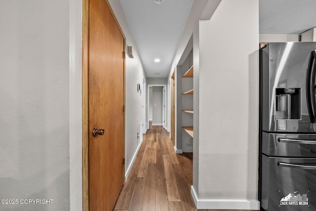 645 W Sarahs Way, Wasilla, AK 99654 - corridor featuring wood finished floors and baseboards