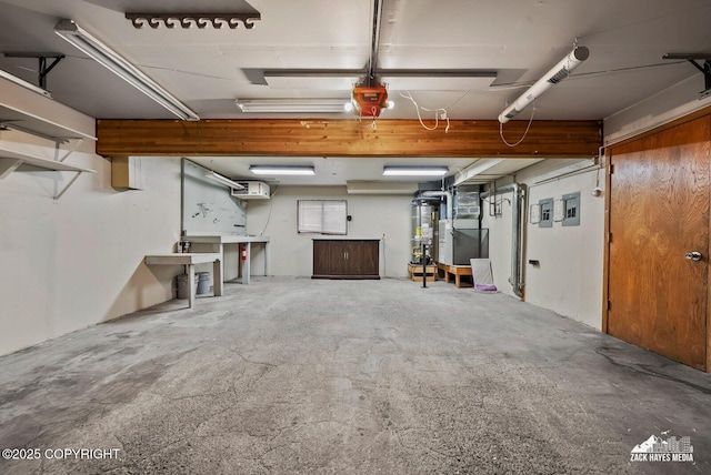 645 W Sarahs Way, Wasilla, AK 99654 - garage featuring heating unit, a garage door opener, and electric panel