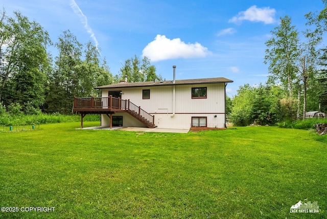 645 W Sarahs Way, Wasilla, AK 99654 - back of property with a wooden deck, a lawn, a patio area, and stairway