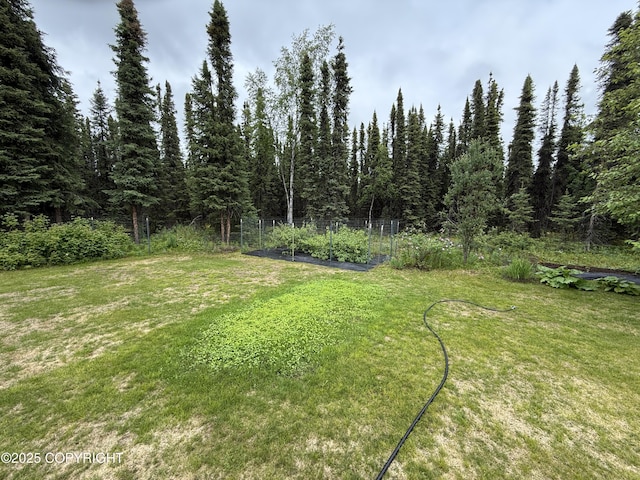 39740 Billikin St, Sterling, AK 99672 - view of green lawn with a vegetable garden
