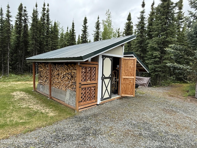 39740 Billikin St, Sterling, AK 99672 - view of outbuilding with a forest view