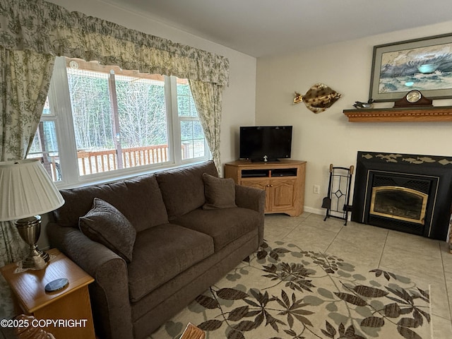 39740 Billikin St, Sterling, AK 99672 - living room with light tile patterned floors and a glass covered fireplace