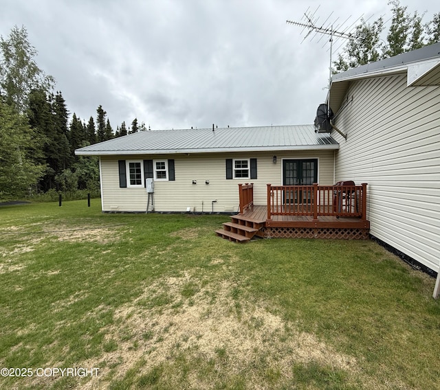 39740 Billikin St, Sterling, AK 99672 - rear view of property featuring a deck, a yard, a metal roof, and french doors