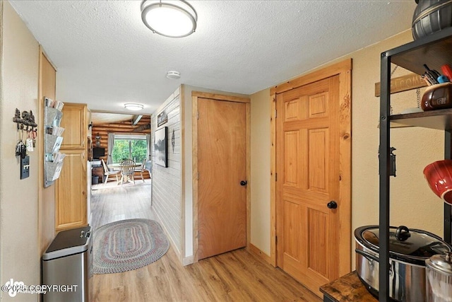 48416 Bernice Lake Rd, Nikiski/North Kenai, AK 99611 - foyer entrance featuring wood finished floors and a textured ceiling