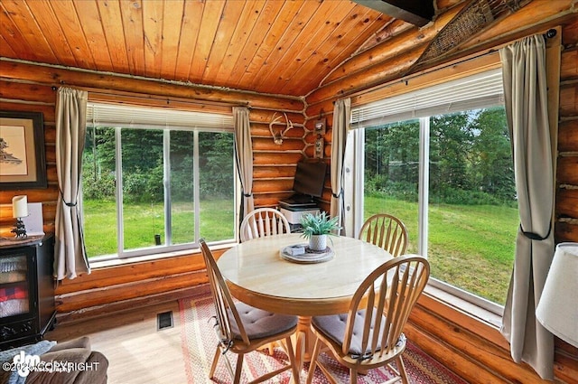 48416 Bernice Lake Rd, Nikiski/North Kenai, AK 99611 - dining area featuring rustic walls, wood finished floors, wooden ceiling, and vaulted ceiling