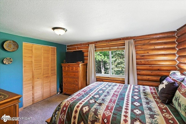 48416 Bernice Lake Rd, Nikiski/North Kenai, AK 99611 - carpeted bedroom featuring log walls, a textured ceiling, and a closet