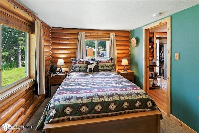 48416 Bernice Lake Rd, Nikiski/North Kenai, AK 99611 - carpeted bedroom with rustic walls and a textured ceiling