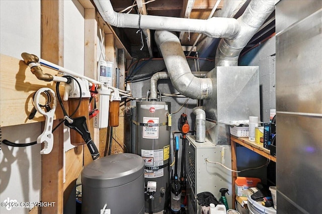 48416 Bernice Lake Rd, Nikiski/North Kenai, AK 99611 - utility room featuring strapped water heater