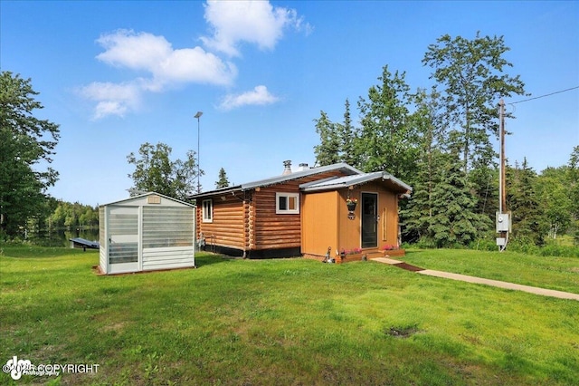 48416 Bernice Lake Rd, Nikiski/North Kenai, AK 99611 - view of greenhouse featuring a yard
