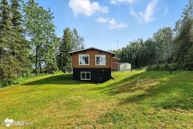 48416 Bernice Lake Rd, Nikiski/North Kenai, AK 99611 - view of side of home featuring a lawn and log exterior