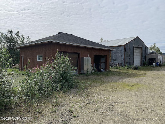 2004 N Old Steese Hwy, Fairbanks, AK 99712 - view of property exterior with a garage and an outdoor structure