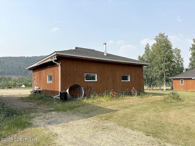 2004 N Old Steese Hwy, Fairbanks, AK 99712 - view of side of home featuring a yard