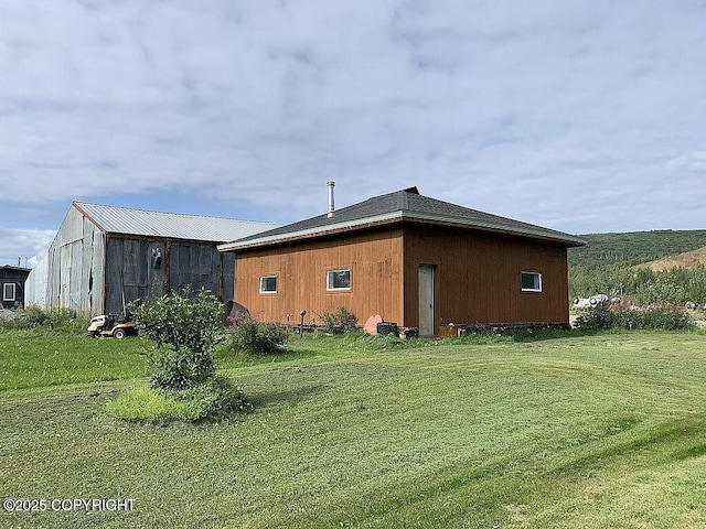 2004 N Old Steese Hwy, Fairbanks, AK 99712 - view of side of home with a yard