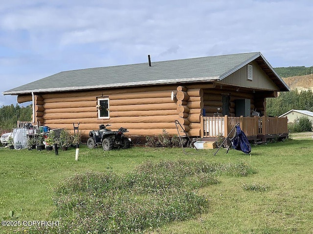 2004 N Old Steese Hwy, Fairbanks, AK 99712 - back of property with log exterior and a yard