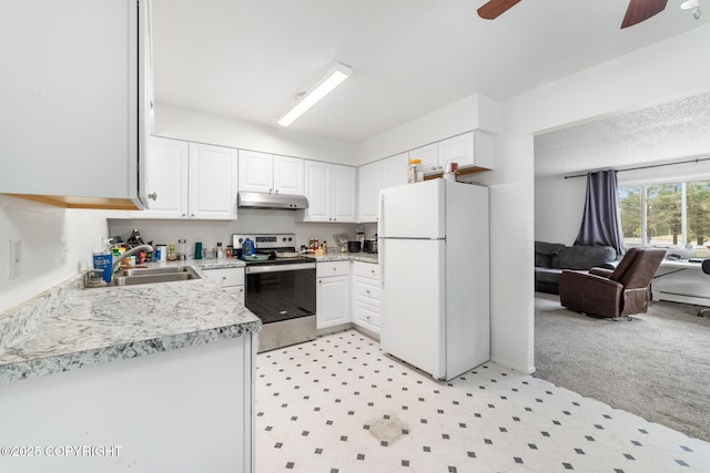 8764 Trinity Dr, Juneau, AK 99801 - kitchen with freestanding refrigerator, electric range, under cabinet range hood, a ceiling fan, and light countertops